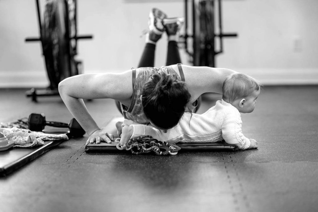 Mother Exercising with Child Mighty Mom Prenatal Postpartum Mom & Baby Fitness Programs Toronto Ontario Online Fitness for Mothers Women